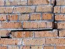 brick wall with big crack
