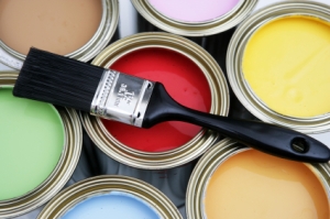 Brush on various colour paint tins